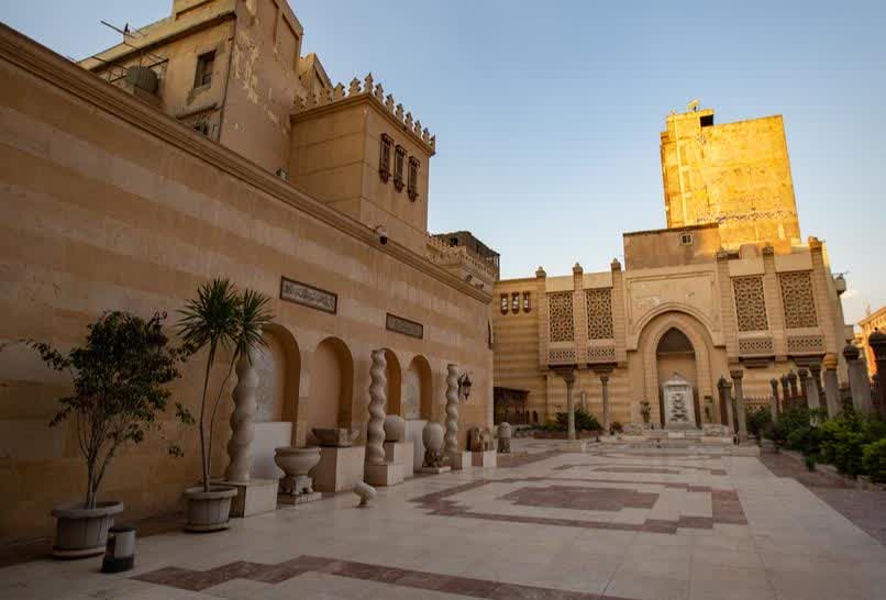 Historic Al-Muizz street in Old Cairo with stone architecture and local life